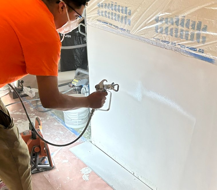 Professional paint application and finishing on a water damage repair