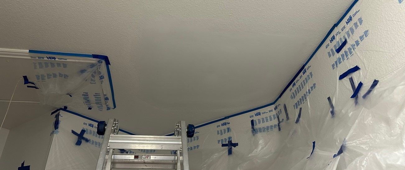 Drywall taping and joint compound application during water damage repair